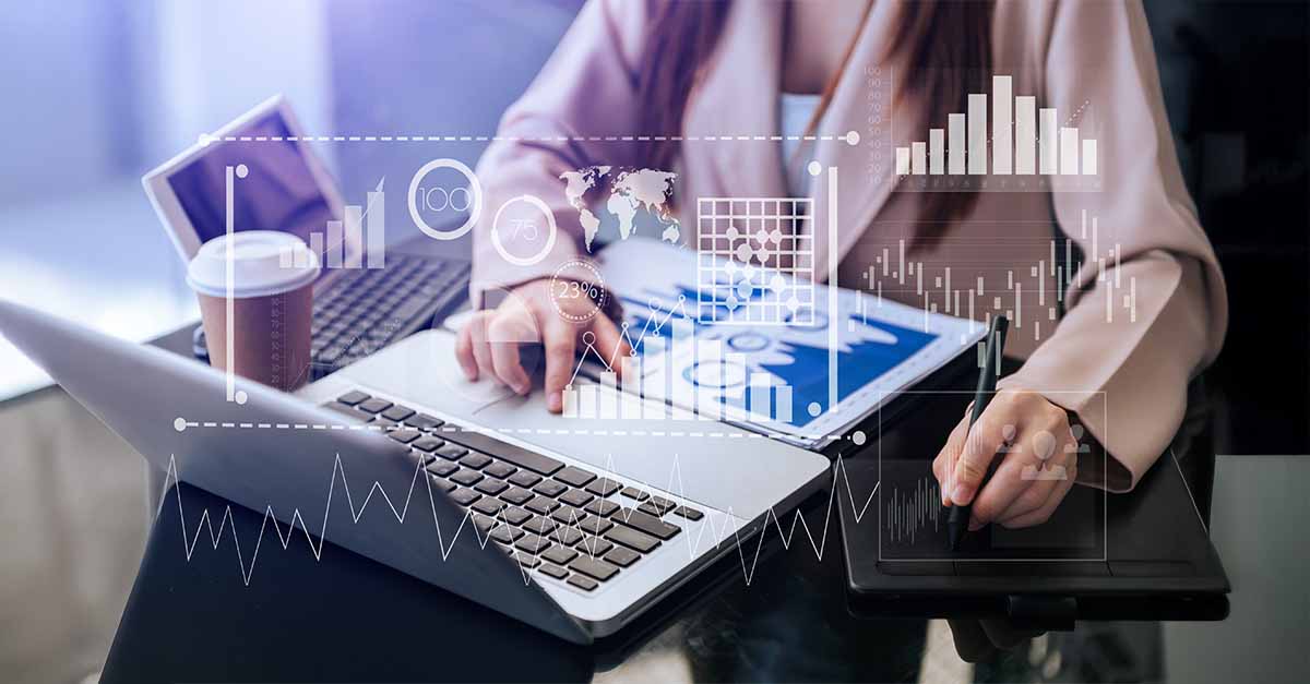 Business professional analyzing data with digital graphs overlay.
