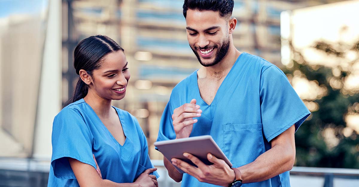 Healthcare professionals working on an tablet