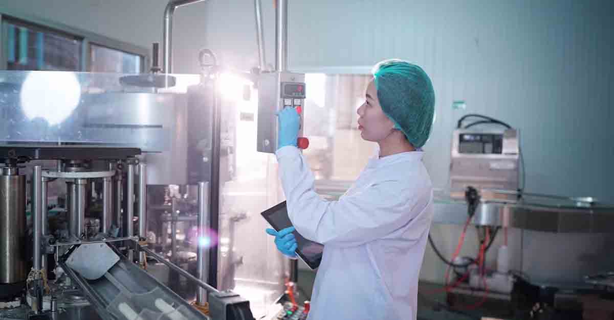 Technician operating machinery in a lab