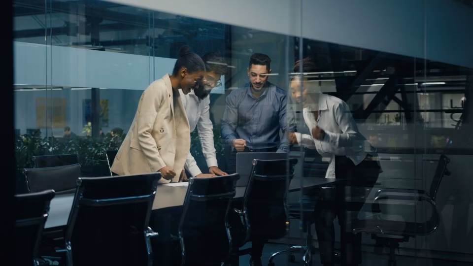 Team celebrating in a conference room